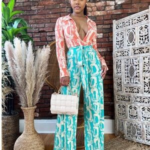 Turquoise and peach jumpsuit very stretchy size Large